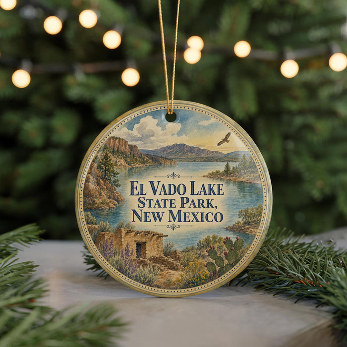 A round ornament with a scenic image of El Vado Lake State Park in New Mexico, featuring a lake, mountains, and a bird in flight.