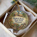 A decorative ornament in a box, featuring illustrations of rocks and a bridge, with the text "Elephant Rocks State Park, Missouri" printed on it.