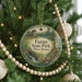 A round ornament on a Christmas tree, featuring a scenic landscape with a bridge and a house, with the text "Farny State Park, New Jersey" displayed on it.