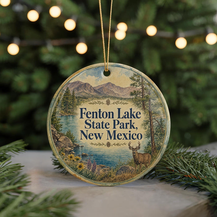 A round ornament with a scenic image of Fenton Lake State Park, New Mexico, featuring a deer and mountains in the background.