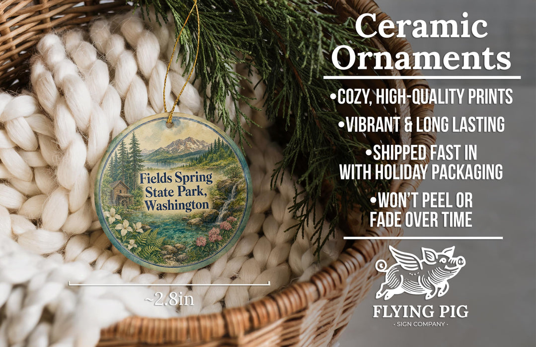 Ceramic ornaments, featuring a design of a house and trees, are displayed in a basket.