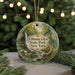 A round ornament with a scenic image of Fillmore Glen State Park, New York, hanging from a string.