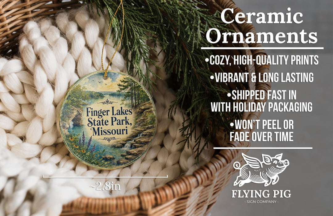 Ceramic ornaments, featuring a scenic image of Finger Lakes State Park, Missouri, hanging from a wicker basket.