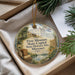 A decorative ornament with a picture of the Missouri State Capitol and historic site, surrounded by greenery and a ribbon.