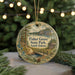 A round ornament with a scenic illustration of Fisher Grove State Park, South Dakota, hanging from a string.