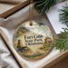 A round ornament with a scenic image of Fort Cobb State Park, Oklahoma, hanging from a string.