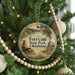 A round ornament on a Christmas tree, featuring a scenic image of Fort Cobb State Park, Oklahoma.