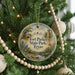A round ornament on a Christmas tree, featuring a scenic image of Fort Parker State Park, Texas.