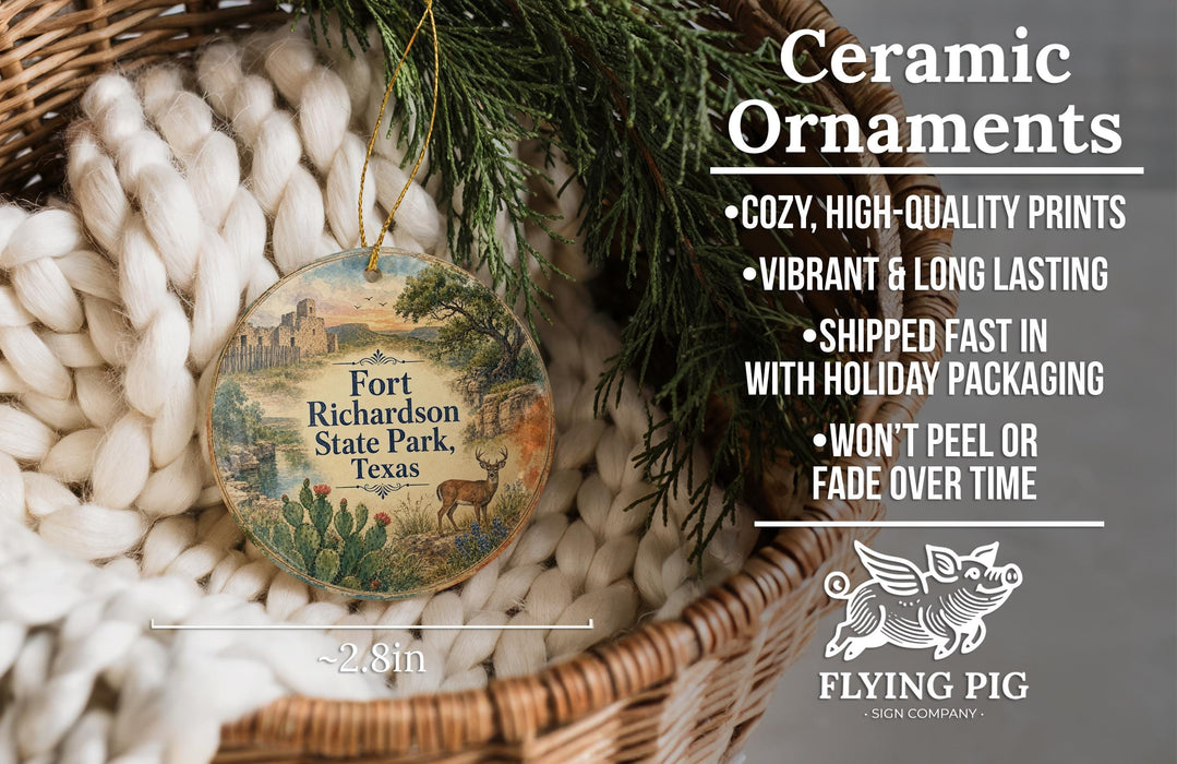 Ceramic ornaments, featuring a round ornament with a landscape scene and a small pig, are displayed in a woven basket.