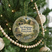A round ornament hanging on a Christmas tree, featuring a scenic image of Fort Washington State Park, Pennsylvania.