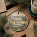 A round ornament with a lighthouse and a coastal scene, featuring the text "Fort Worden State Park, Washington".