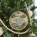 A round ornament hanging on a Christmas tree, featuring a scenic landscape of Fremont Lakes State Recreation Area in Nebraska.
