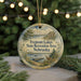 A round ornament with a scenic landscape of Fremont Lakes, Nebraska, featuring a deer, boats, and a lake.