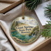 A decorative ornament with a scenic landscape of Giant Springs State Park, Montana, featuring a river, mountains, and greenery.