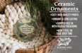 Ceramic ornaments, featuring a detailed image of a scenic landscape, are displayed in a wicker basket. The text highlights the ornaments as "Ceramic Ornaments" with a description of their features, including "Cozy, high-quality prints", "Vibrant & long lasting", "Shipped fast in with holiday packaging", and " Won't peel or fade over time". The image also includes a scale for the ornaments, indicating their size is "2.8in".