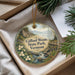 A decorative ornament with a scenic landscape of Gifford Woods State Park, Vermont, featuring a river, mountains, and pine trees.