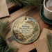 A decorative ornament featuring a pine tree and a log, with text that reads "Ginkgo Petrified Forest State Park, Washington".