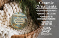 Ceramic ornaments, featuring a design of Glendo State Park, Wyoming, hanging in a basket with pine branches.