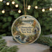 A round ornament with a scenic image of Glitterglass State Park, New York, featuring a lake, a sailboat, and a cabin.