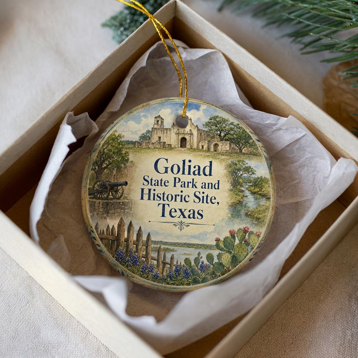 A circular ornament with a picture of a historical site, specifically Golfad State Park and Historic Site, Texas, hanging from a string.