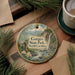 A decorative ornament featuring a scenic landscape of Gorges State Park in North Carolina, with a bird perched on a branch and a waterfall in the background.