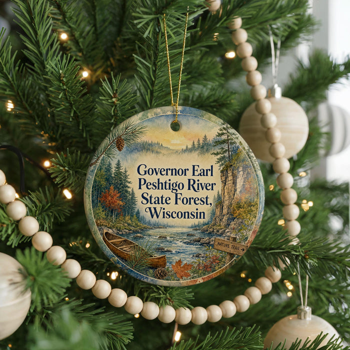 A round ornament hanging on a Christmas tree, featuring a scenic image of the Peshtigo River and the Wisconsin State Forest.