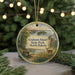 A circular ornament featuring a scenic landscape of Grahams Island State Park in North Dakota, with a bench, deer, and trees in the background.