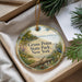 A decorative ornament with a scenic landscape of Grass Point State Park, New York, featuring a bird, pine trees, and a body of water.