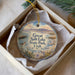 A decorative ornament in a box, featuring a scenic image of Salt Lake State Park in Utah.