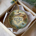 A round ornament with a scenic image of the Green River State Park in Utah, featuring a heron and a mountain landscape.