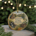 A round ornament featuring a scenic image of the Greenwood Furnace State Park in Pennsylvania, with a string of lights in the background.