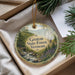 A round ornament with a scenic image of the Groton State Forest in Vermont, featuring a stream and pine trees.