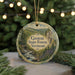 A round ornament with a scenic image of the Groton State Forest in Vermont, featuring a stream and pine trees.