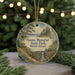 A round ornament with a scenic landscape depicting Haines Memorial State Park, Rhode Island, hanging from a string.