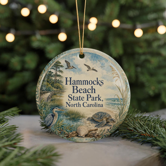 A round ornament with a beach scene and birds, featuring the text "Hammocks Beach State Park, North Carolina".