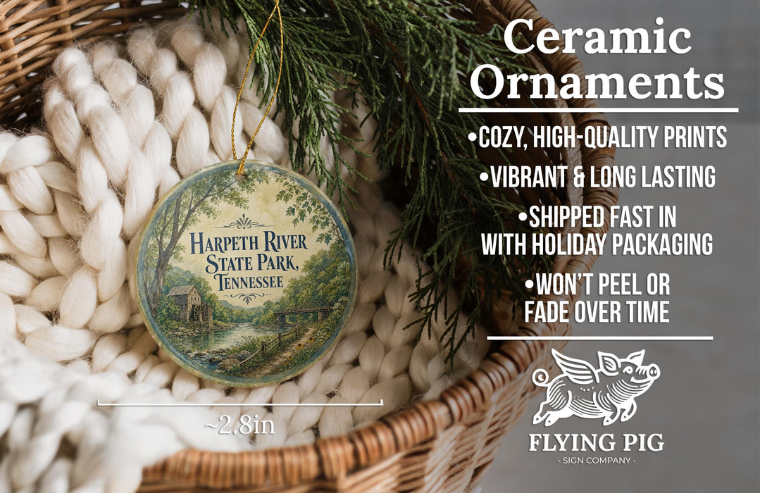 Ceramic ornaments, featuring a detailed illustration of Harpeth River State Park, Tennessee, hanging from a wicker basket.