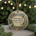A circular ornament with a scenic landscape of Harriman State Park, New York, featuring a bridge, trees, and a waterfall.