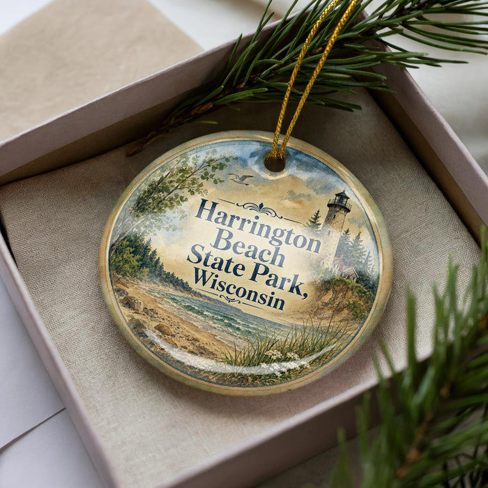 A decorative ornament in a box, featuring a scenic image of Harrington Beach State Park in Wisconsin.