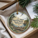 A round ornament with a scenic image of Harstine Island State Park, Washington, hanging from a string.
