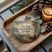 A wooden tray with a decorative ornament featuring a scenic landscape and the text "Hat Rock State Heritage Site, Oregon".