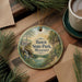 A round ornament with a scenic illustration of Hawn State Park, Missouri, hanging on a wooden surface.