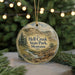 A round ornament with a scenic image of Hell Creek State Park, Montana, featuring a dinosaur and a river.
