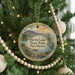 A round ornament on a Christmas tree, featuring a scenic image of Heron Lake State Park in New Mexico.
