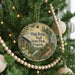 A round ornament hanging on a Christmas tree, featuring an illustration of the High Bridge Trail in Virginia.