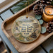 A wooden tray with a decorative ornament featuring an illustration of a train and mountains, along with the text "Historic Union Pacific Rail Trail State Park, Utah".