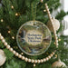 A round ornament hanging on a Christmas tree, featuring a scenic image of Hochatown State Park, Oklahoma.