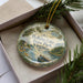 A decorative ornament with a scenic lake and forest landscape, featuring the text "Holliday Lake State Park, Virginia".