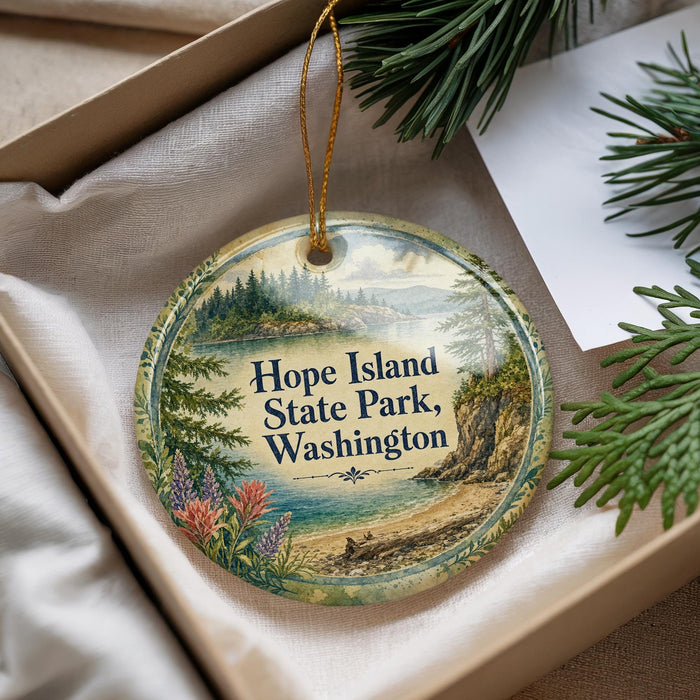 A decorative ornament with a scenic landscape of Hope Island State Park, Washington, featuring pine trees, a lake, and mountains.