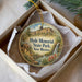 A decorative ornament in a box, featuring a scenic landscape with a waterfall and mountains, along with the text "Hyde Memorial State Park, New Mexico".