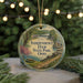 A round ornament with a scenic image of Independence Dam State Park, Ohio, surrounded by greenery and twinkling lights.